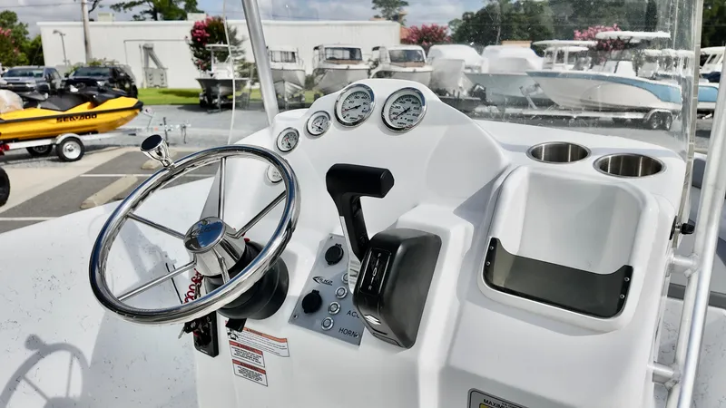 Slide: The Image of Steering console of 2026 ALK2 Powerboats 18 CRS with gauges and controls. - 5