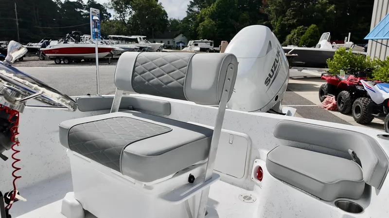 Slide: The Image of 2026 ALK2 Powerboats 18 CRS with gray seating and Suzuki outboard motor. - 8