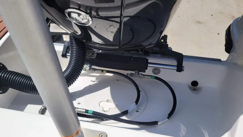 Slide: The Image of 2024 Trophy T20CC boat engine compartment with cables and hydraulic components. - 15