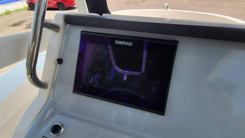Slide: The Image of Simrad display on 2024 Trophy t20cc boat dashboard, with visible steering wheel and controls. - 26
