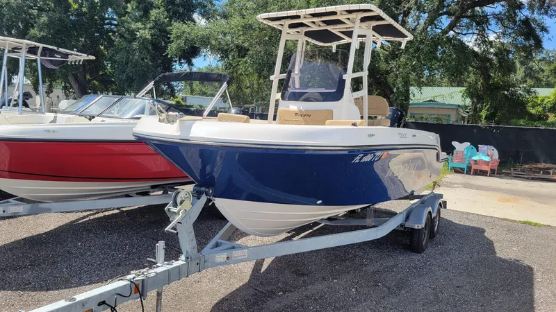 Slide: The Image of 2024 Trophy T20CC boat on trailer, parked outdoors, surrounded by other boats. - 3