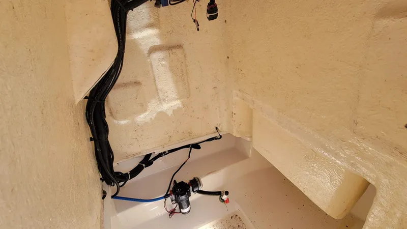 Slide: The Image of Interior view of 2024 Trophy T20CC boat showing wiring and components. - 34