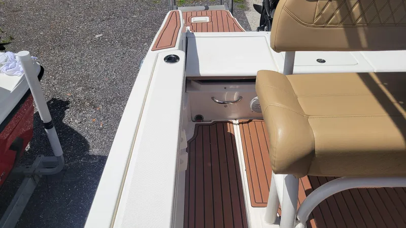 Slide: The Image of 2024 Trophy T20CC boat interior with tan seating and wood-style flooring. - 35
