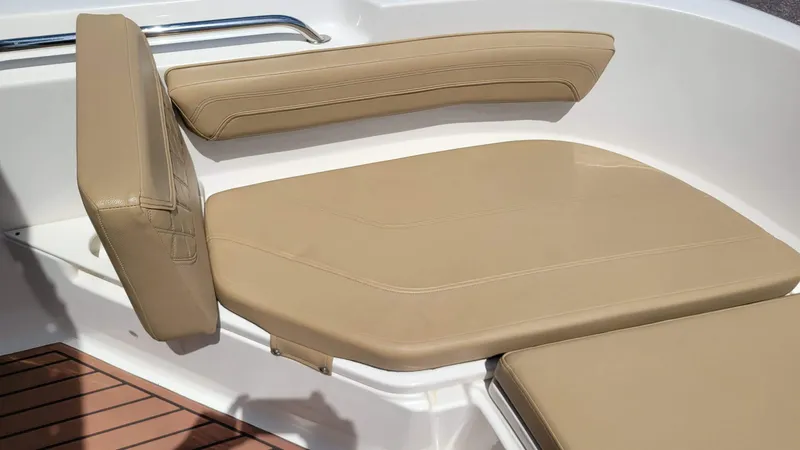 Slide: The Image of 2024 Trophy T20CC boat seating with tan cushions and white interior. - 42