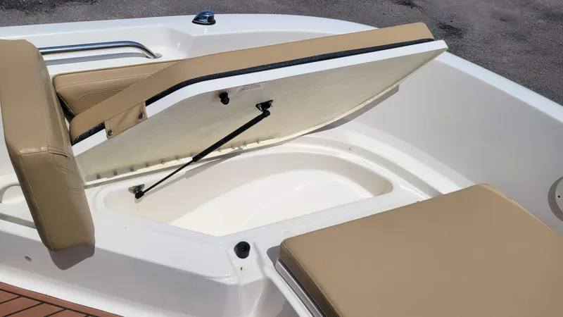 Slide: The Image of Open storage compartment on 2024 Trophy T20CC boat with beige seating. - 43