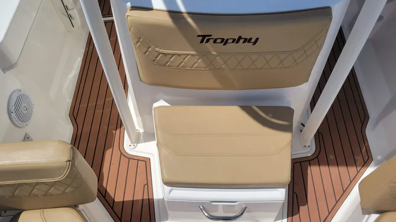Slide: The Image of 2024 Trophy T20CC boat interior with tan seating and wood-patterned flooring. - 45
