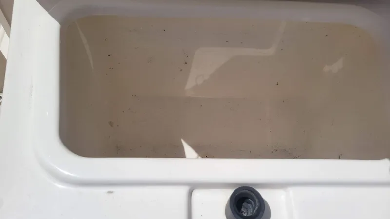 Slide: The Image of Empty white compartment of a 2024 Trophy T20CC boat. - 48