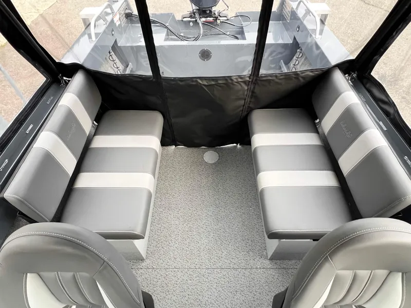 Slide: The Image of 2025 Hewescraft 180 Sportsman interior with gray seating and modern design. - 5