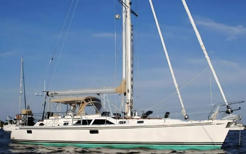 The Image of 2008 Hylas 46 sailboat on calm water under clear blue sky. - 0
