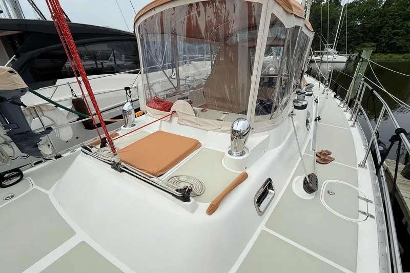 Slide: The Image of 2008 Hylas 46 sailboat deck with cockpit enclosure and winches. - 17