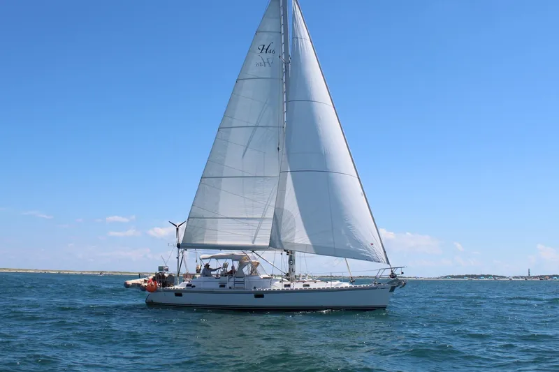 Slide: The Image of Sailing yacht Hylas 46, 2008 model, cruising on open water under clear blue skies. - 2