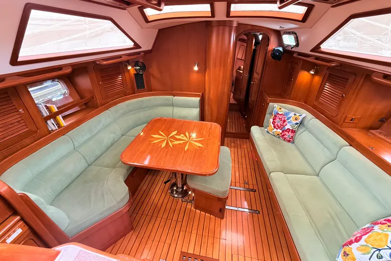 Slide: The Image of Luxurious interior of 2008 Hylas 46 yacht with elegant wood finish and plush seating. - 21