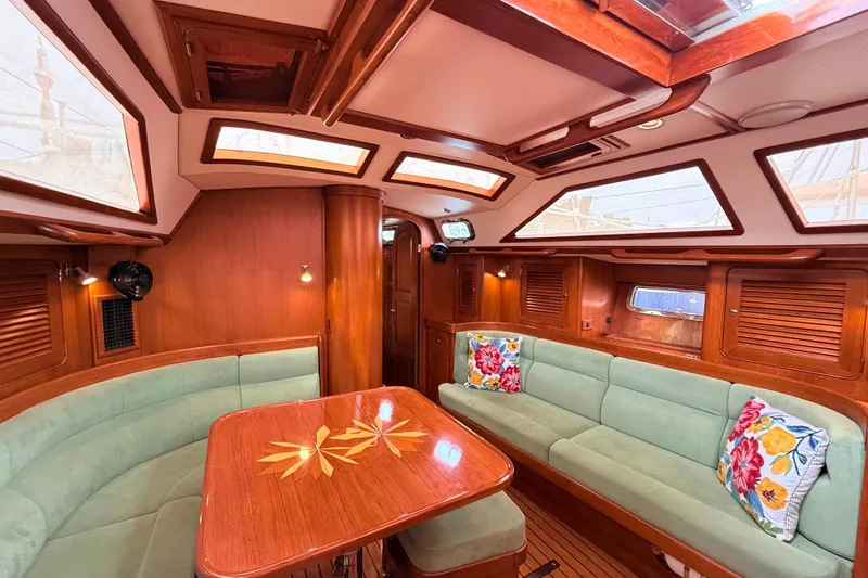 Slide: The Image of Luxurious 2008 Hylas 46 yacht interior with elegant wood finish and plush seating. - 23