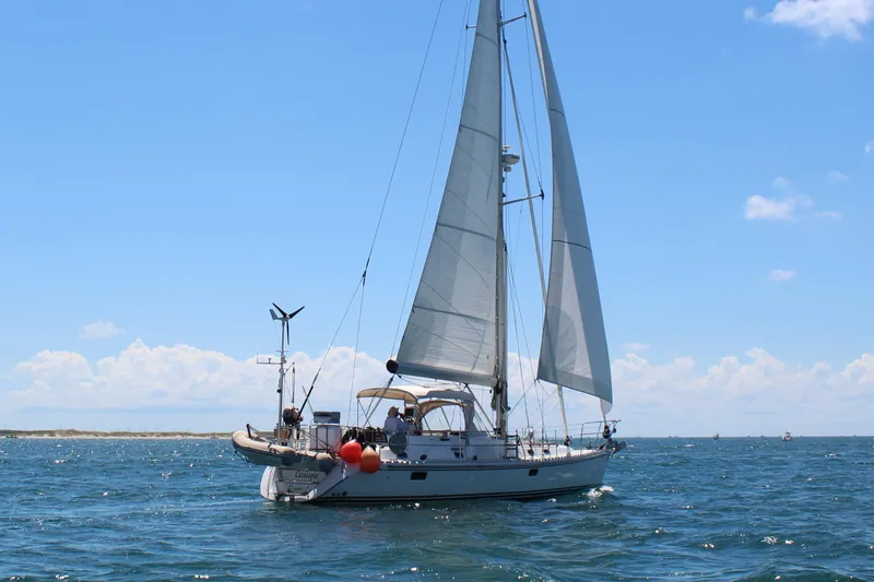 Slide: The Image of Sailing yacht Hylas 46, 2008 model, cruising on open sea under clear blue sky. - 3