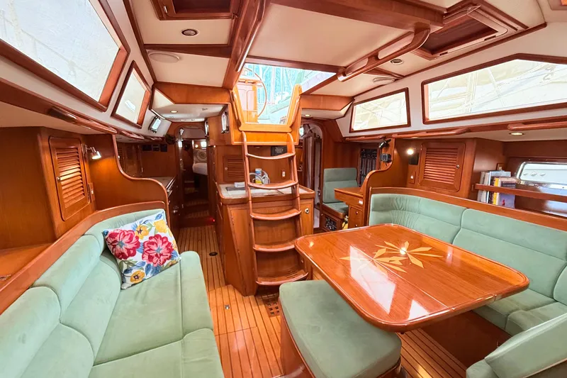 Slide: The Image of Luxurious 2008 Hylas 46 yacht interior with elegant wood finish and plush seating. - 36
