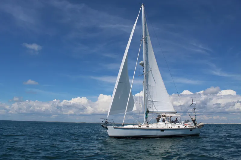 Slide: The Image of Sailing yacht Hylas 46, 2008 model, cruising on open sea under clear blue skies. - 4