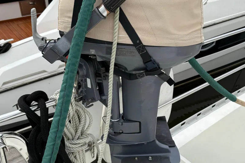 Slide: The Image of Outboard motor on a 2008 Hylas 46 yacht, secured with ropes and straps. - 42