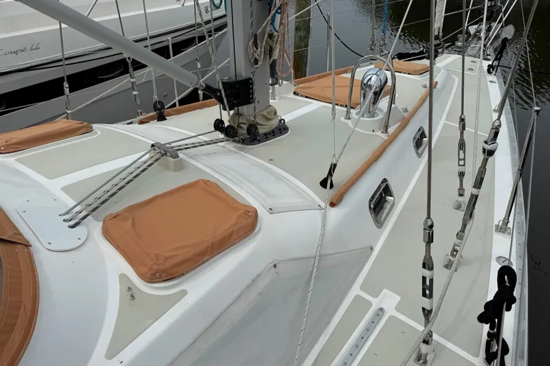 Slide: The Image of 2008 Hylas 46 sailboat deck with rigging and tan covers. - 9