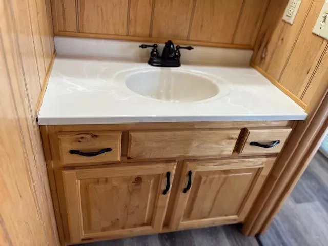Slide: The Image of Wooden bathroom vanity with white countertop in 2001 Horizon 16 x 70 houseboat. - 21