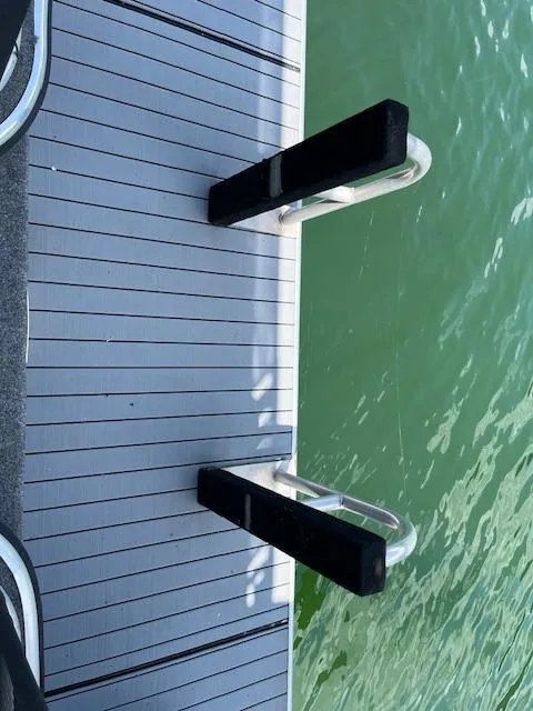 Slide: The Image of Houseboat swim platform with ladder on green water, Horizon 16 x 70, 2001 model. - 27