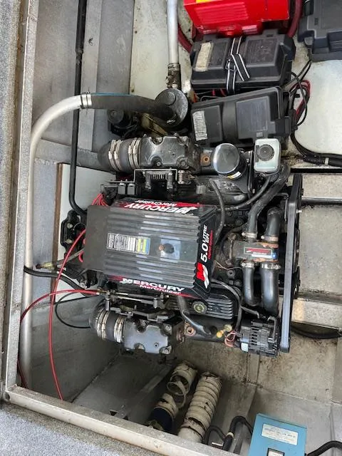 Slide: The Image of Engine compartment of a 2001 Horizon 16 x 70 Houseboat, featuring a Mercury 5.0L engine. - 29