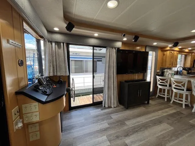 Slide: The Image of Interior of a 2001 Horizon 16 x 70 houseboat with modern decor and large windows. - 7