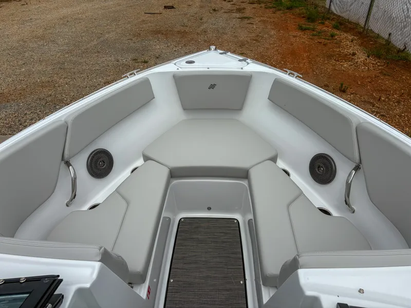 Slide: The Image of 2026 Four Winns H2 Freedom boat interior with gray seating and speakers. - 9