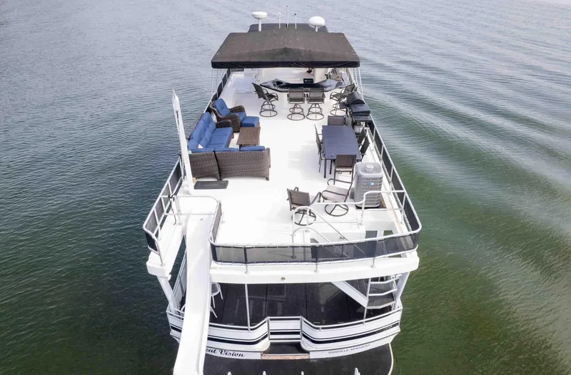 Slide: The Image of Luxurious 2008 Monticello houseboat with spacious deck, seating, and slide on calm water. - 10