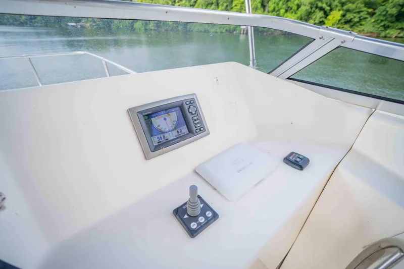 Slide: The Image of Control panel of a 2008 Monticello Houseboat with navigation display and joystick. - 21