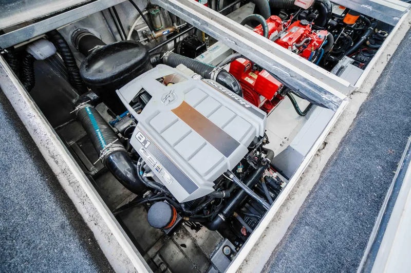 Slide: The Image of Engine compartment of a 2008 Monticello Houseboat, showcasing detailed mechanical components. - 37