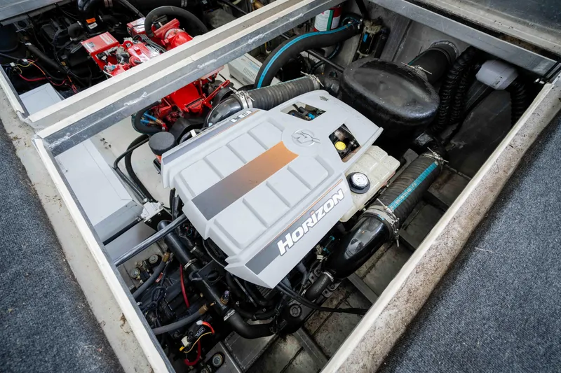 Slide: The Image of Engine compartment of a 2008 Monticello Houseboat, featuring a Horizon engine. - 41