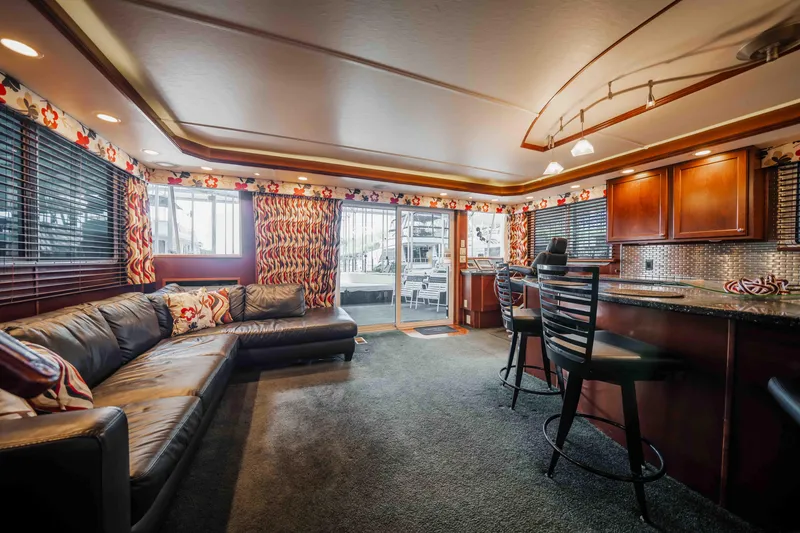 Slide: The Image of Luxurious 2008 Monticello houseboat interior with modern kitchen, cozy seating, and elegant decor. - 42