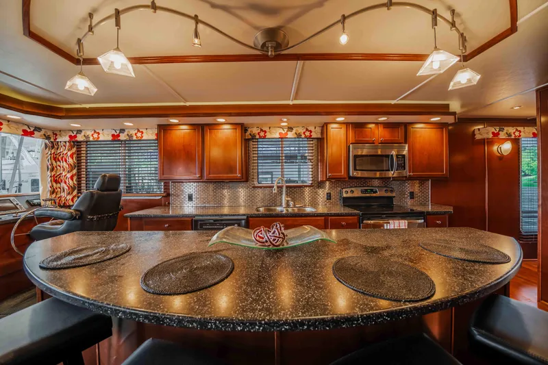 Slide: The Image of Luxurious 2008 Monticello houseboat kitchen with modern appliances and elegant lighting. - 47
