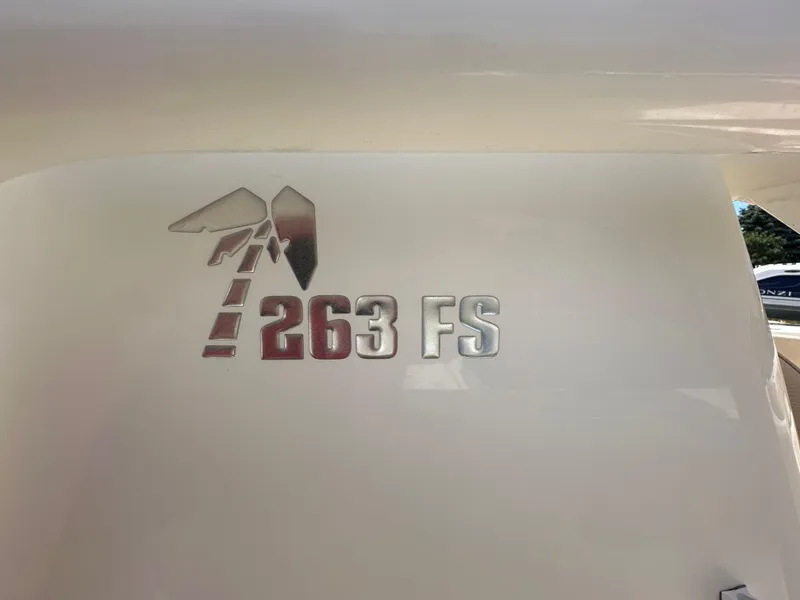 Slide: The Image of Key West 263 FS 2019 boat logo on white surface. - 12