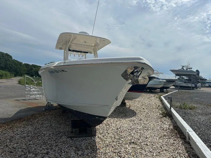 Slide: The Image of 2019 Key West 263 FS boat on gravel, clear sky background. - 4