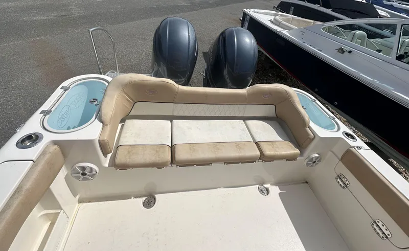 Slide: The Image of 2019 Key West 263 FS boat interior with seating and dual engines. - 5