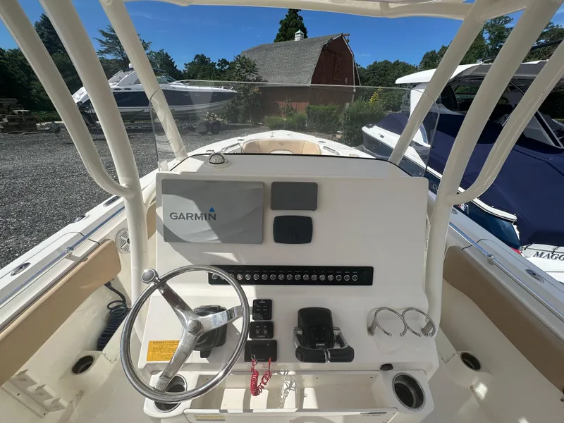 Slide: The Image of 2019 Key West 263 FS boat dashboard with Garmin navigation system and steering wheel. - 9