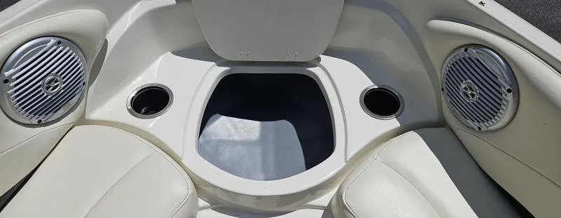 Slide: The Image of Interior of 2016 Stingray 225RX boat with speakers and cup holders. - 11