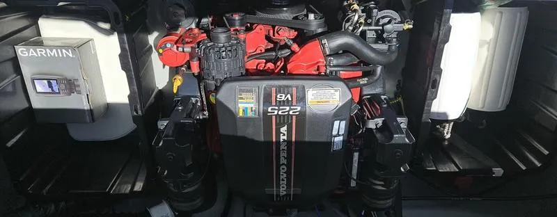 Slide: The Image of Engine compartment of a 2016 Stingray 225RX boat with Garmin equipment. - 14