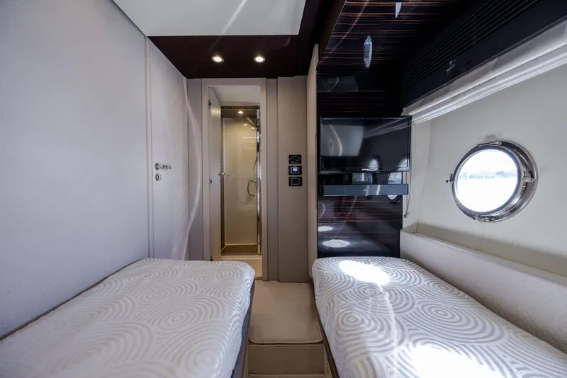 Slide: The Image of Luxurious cabin interior of 2019 Azimut 66 FLY yacht with twin beds and porthole window. - 24