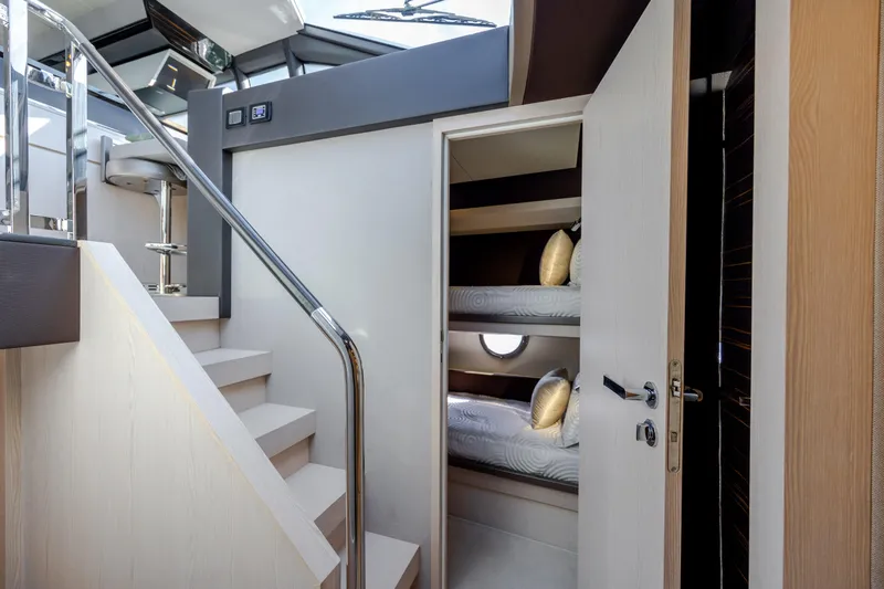 Slide: The Image of Interior of 2019 Azimut 66 FLY yacht with bunk beds and modern staircase. - 27