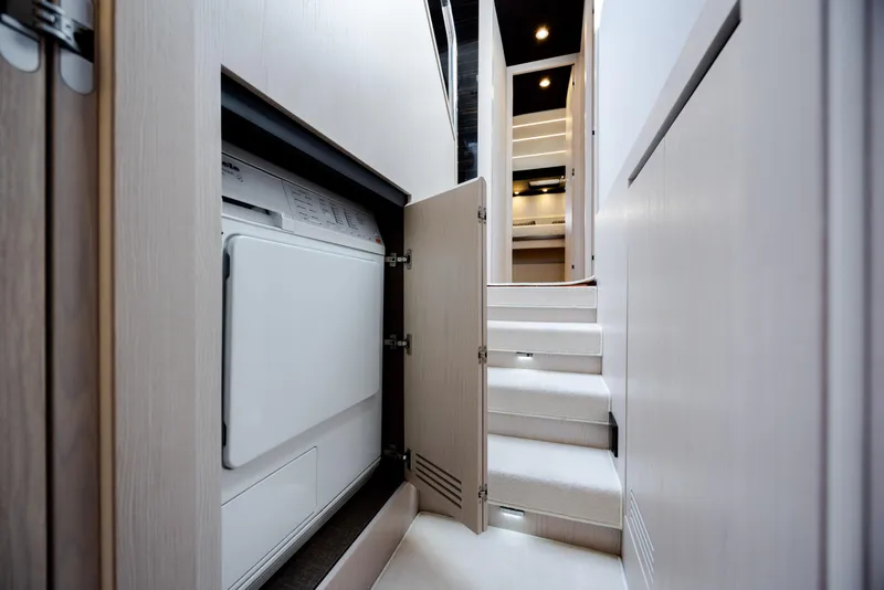 Slide: The Image of Interior of 2019 Azimut 66 FLY yacht with laundry area and stairs. - 32