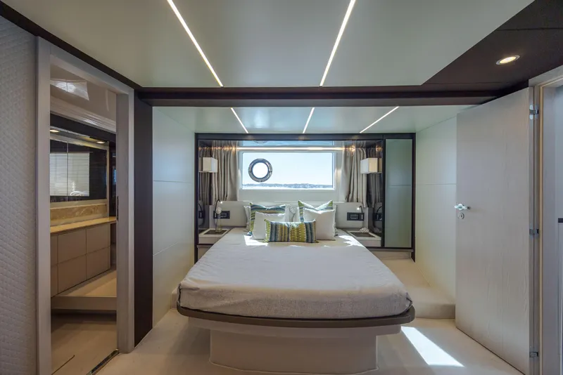 Slide: The Image of Luxurious bedroom interior of 2019 Azimut 66 FLY yacht with modern design and window view. - 34