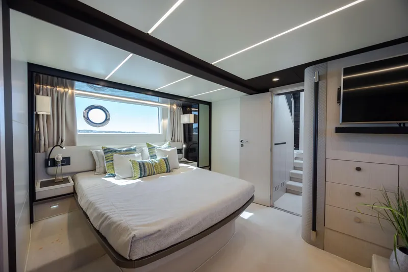 Slide: The Image of Luxurious bedroom interior of 2019 Azimut 66 FLY yacht with modern design and large window. - 35