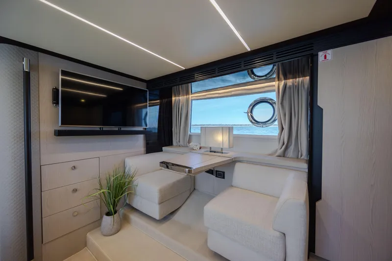 Slide: The Image of Luxurious interior of 2019 Azimut 66 FLY yacht with modern seating and ocean view. - 37