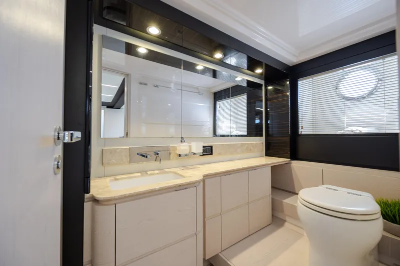 Slide: The Image of Luxurious bathroom interior of 2019 Azimut 66 FLY yacht with modern fixtures and elegant design. - 38