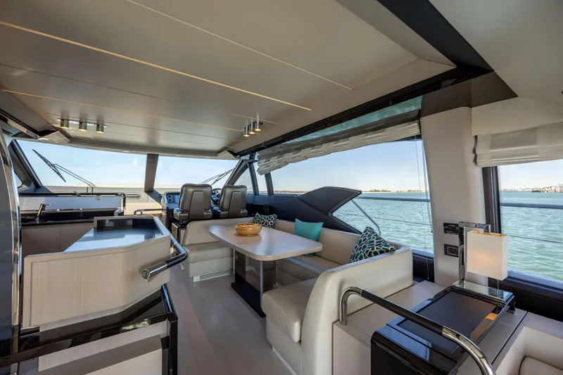 Slide: The Image of Luxurious interior of 2019 Azimut 66 FLY yacht with elegant seating and ocean view. - 44