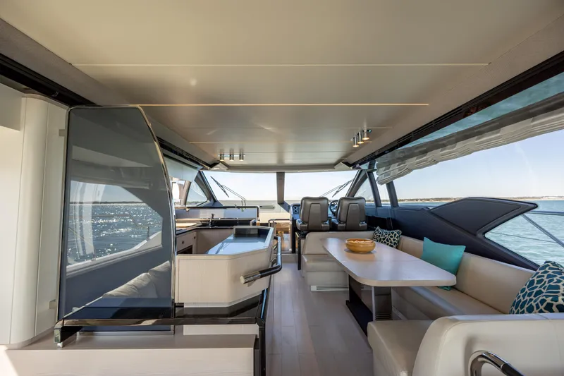 Slide: The Image of Luxurious interior of 2019 Azimut 66 FLY yacht with modern seating and ocean view. - 45
