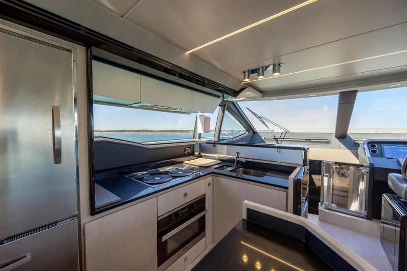 Slide: The Image of Luxurious kitchen interior of 2019 Azimut 66 FLY yacht with modern appliances and ocean view. - 46