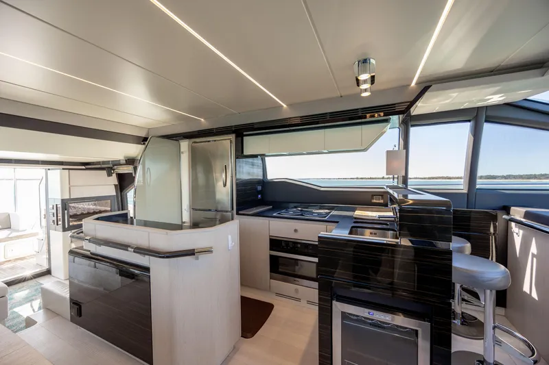 Slide: The Image of Luxurious interior of 2019 Azimut 66 FLY yacht with modern kitchen and seating area. - 47